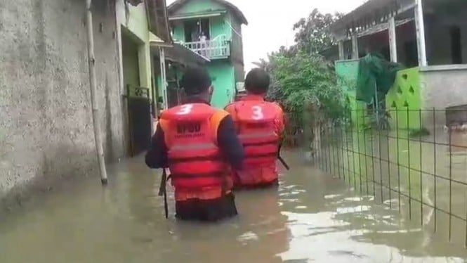 Rumah warga yang terendam banjir akibat luapan Kali Ulu